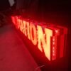 "Illuminated Barber Shop LED Light Sign with bold lettering, designed by Atlantic Design to enhance visibility and attract customers."